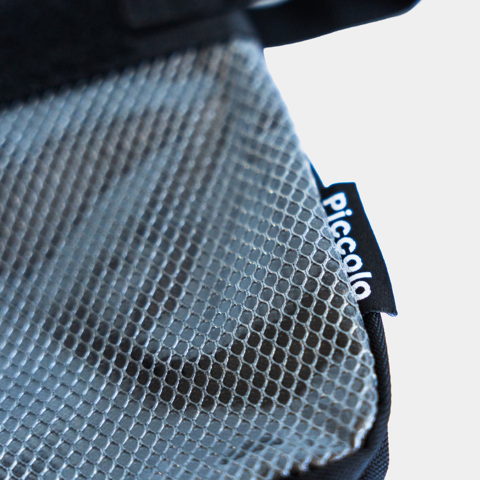 Piccolo branded tag on the Medium Pouch